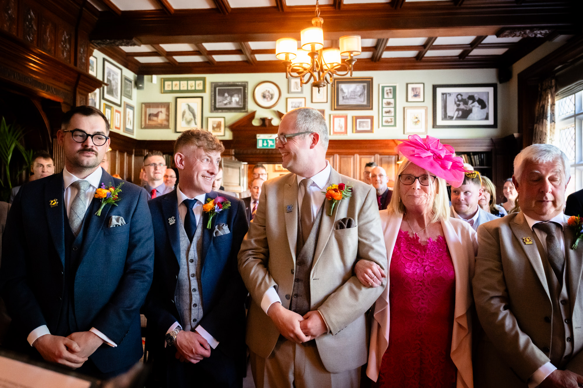 Marc and Dom together at the front with Dom's mum as the ceremony begins.