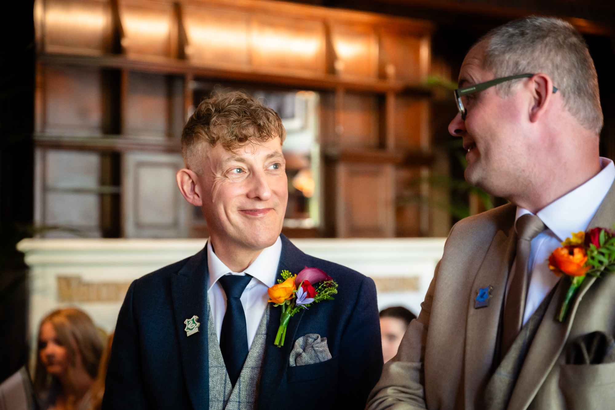 Marc and Dom share a look during their ceremony at The Oakfield.