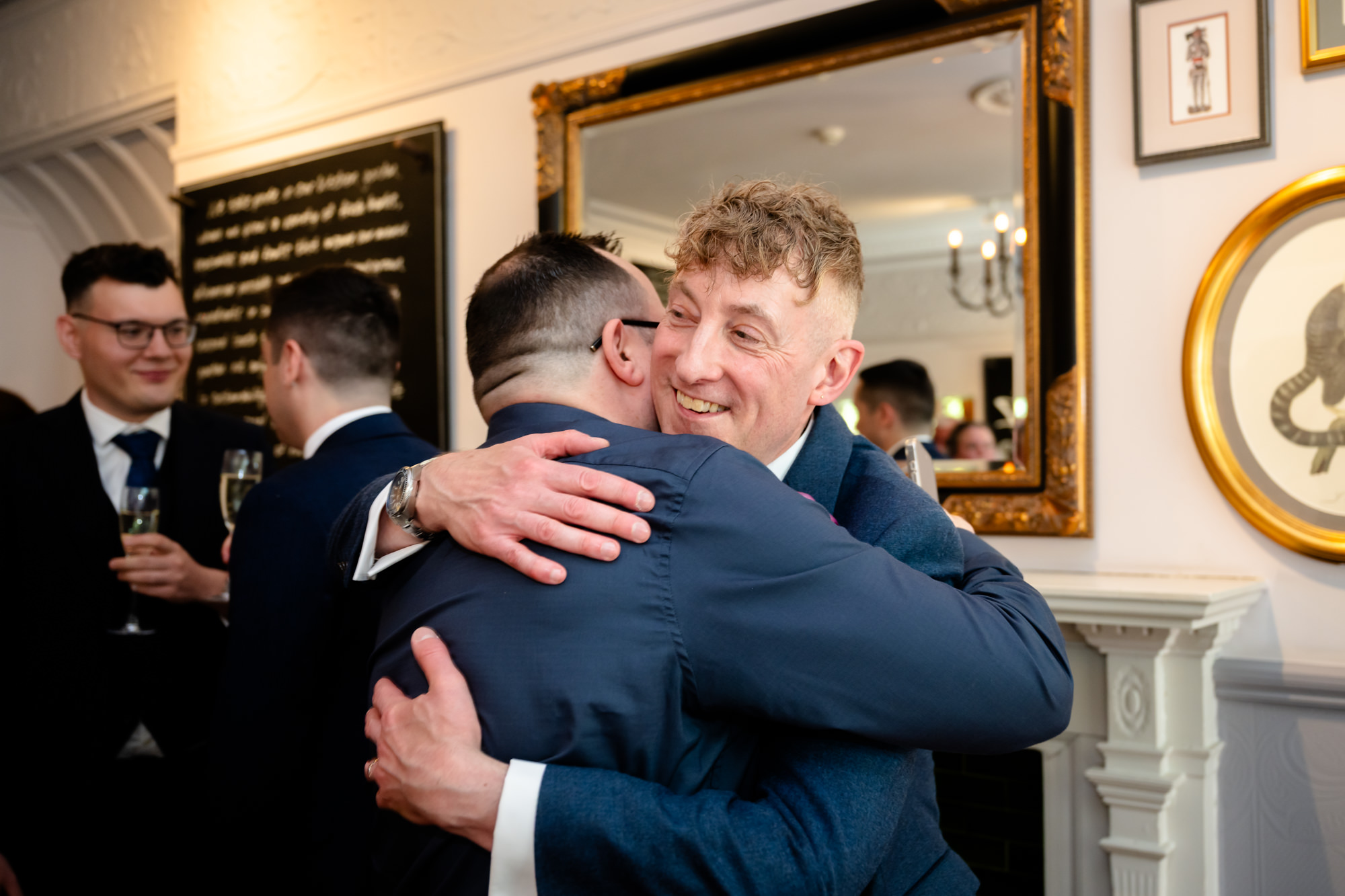 Marc hugs a guest during the drinks reception.