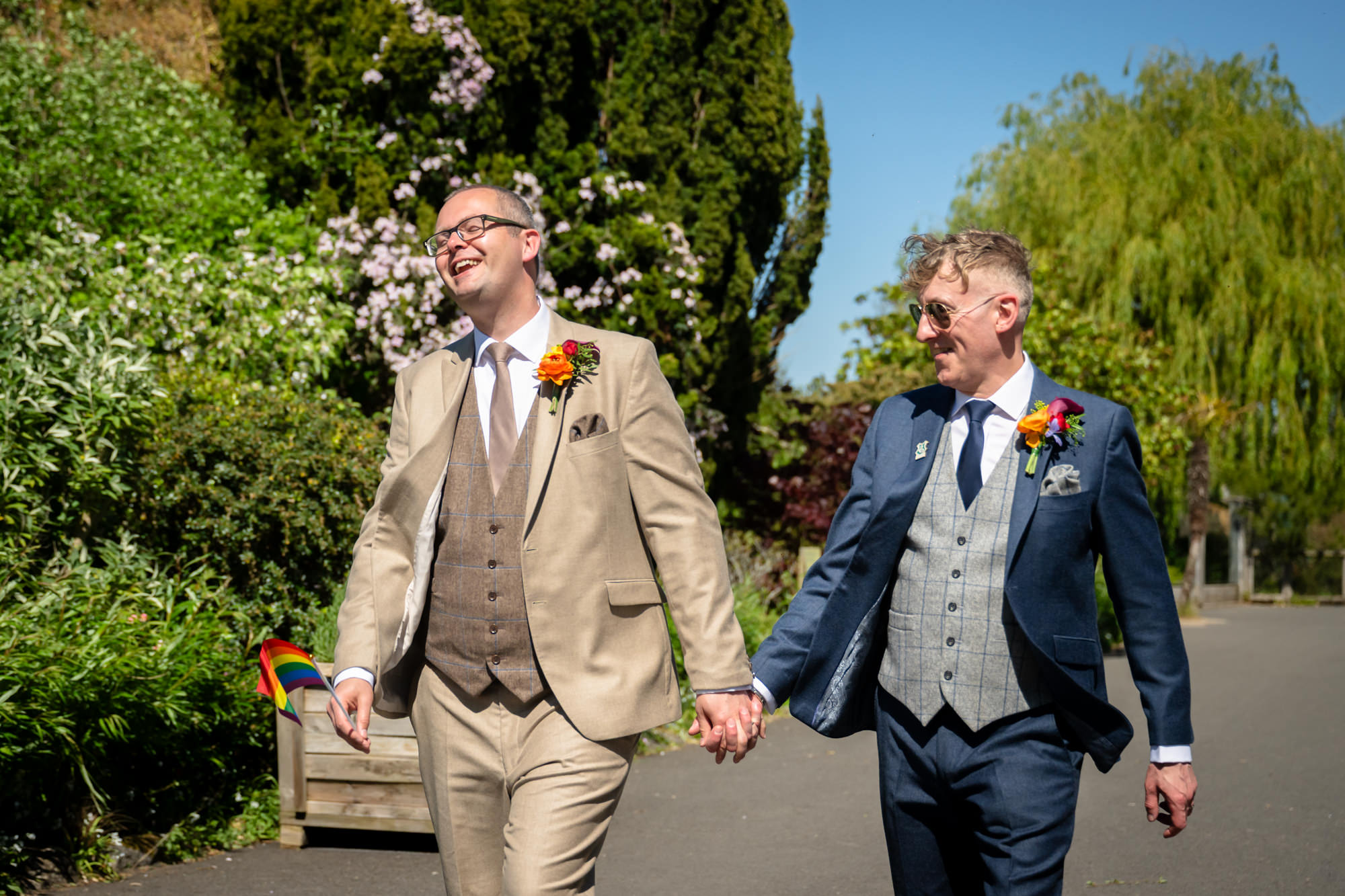 Marc and Dom walk hand in hand through the grounds at Chester Zoo.