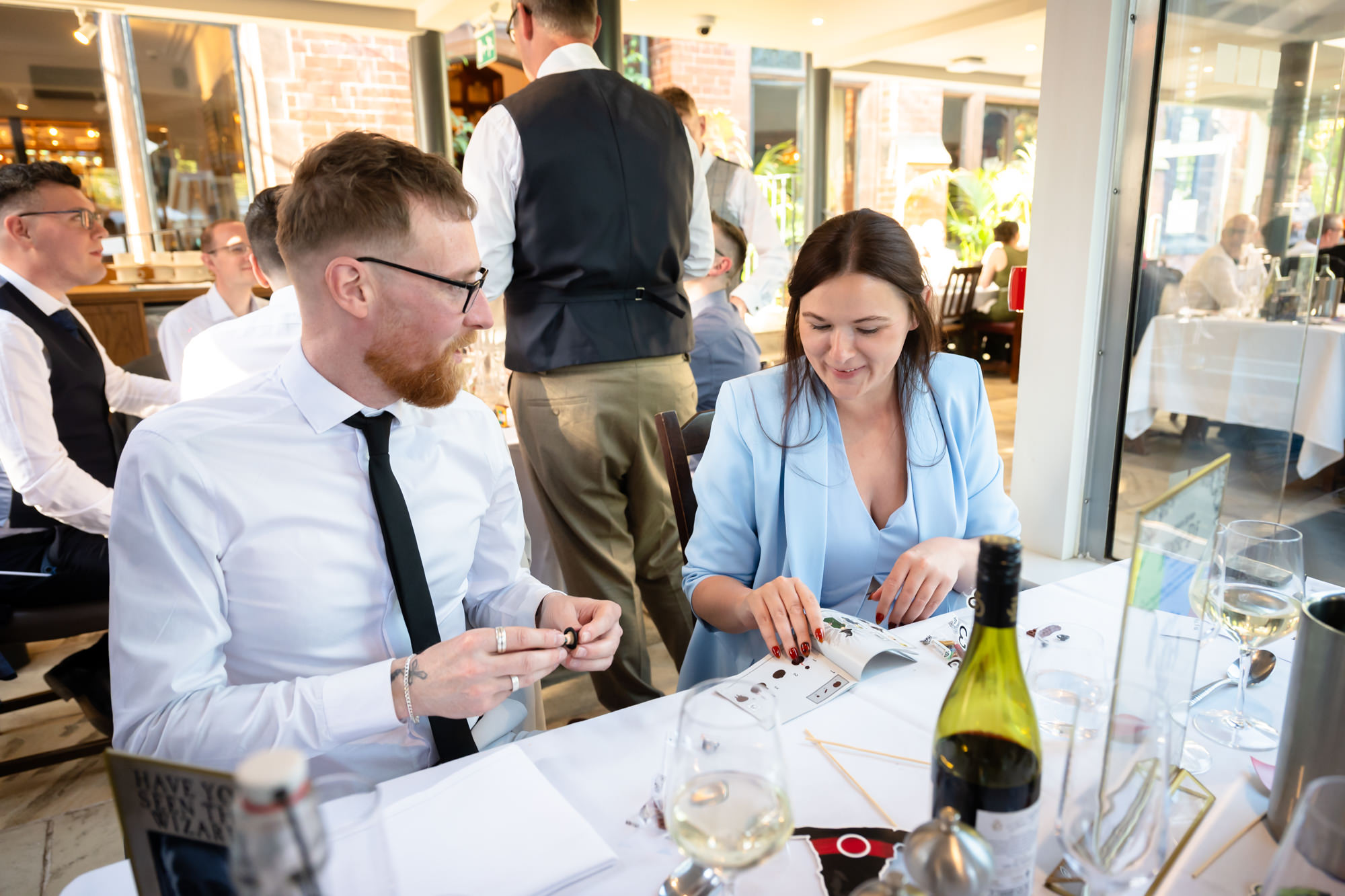 Guests build one of the Harry Potter Lego sorting sets during the wedding breakfast.
