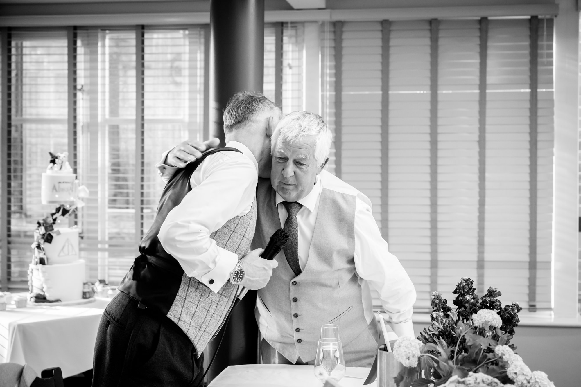 Marc shares an emotional embrace with Dom's dad during the speeches.