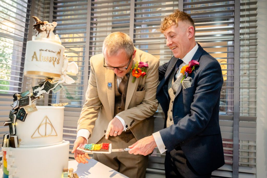 The rainbow sponge is revealed as Marc and Dom cut the first slice.