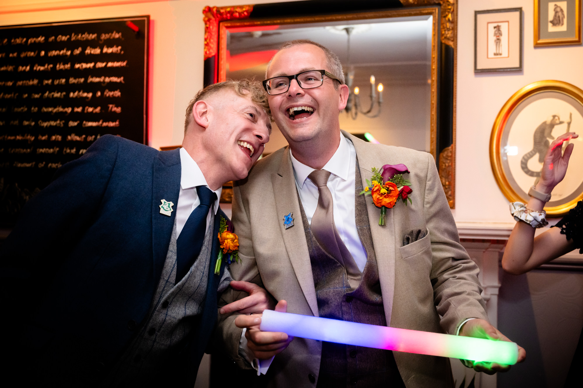 Marc and Dom laughing together on the dance floor.
