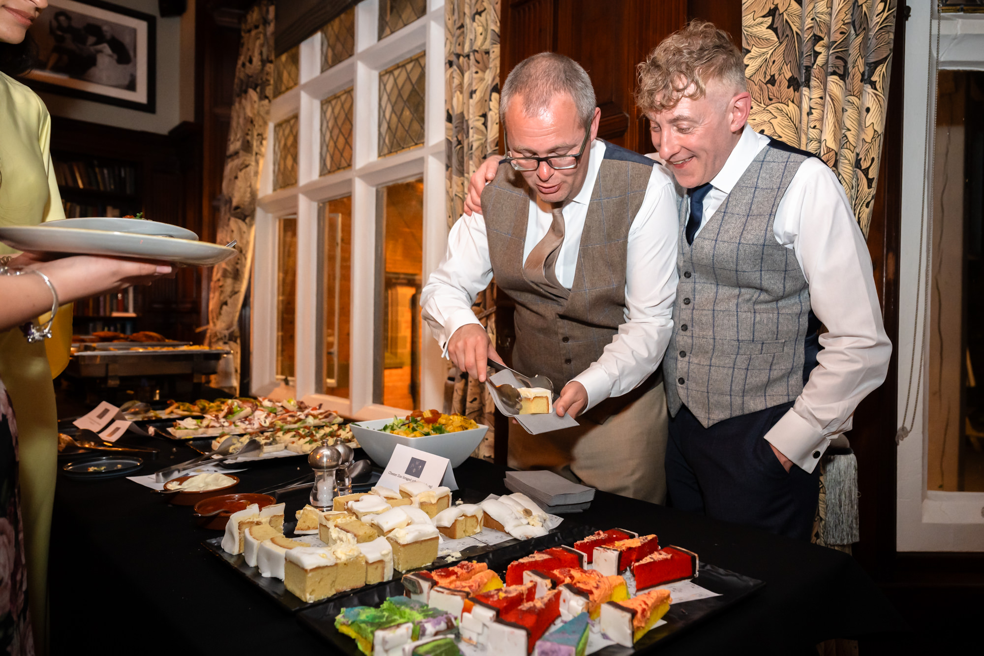 Marc and Dom serve cake to their evening guests at The Oakfield.