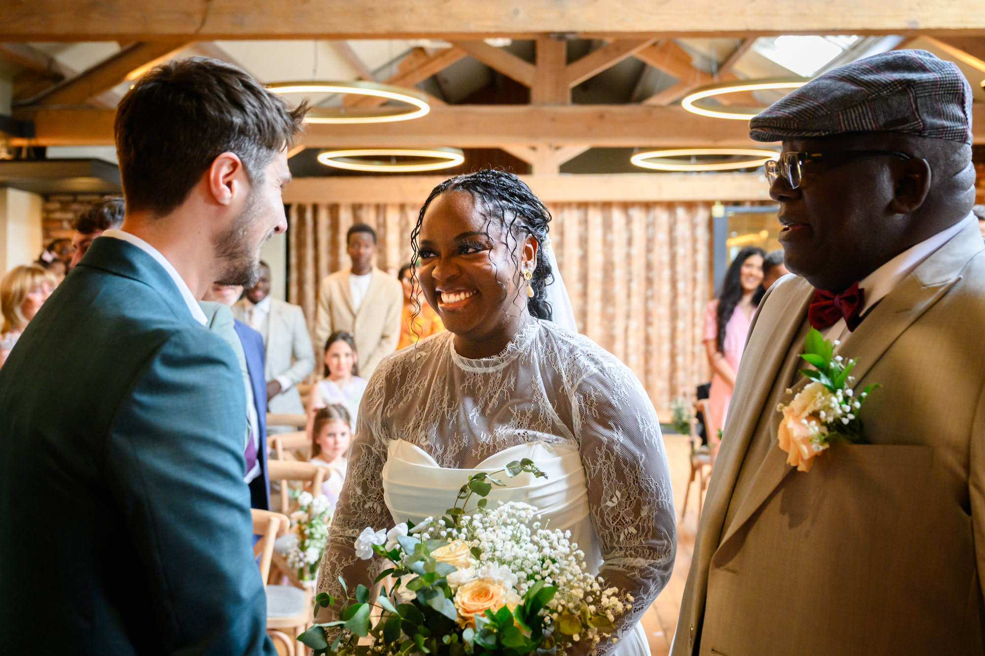 The bride arriving at the altar and meeting the groom for the first time during the ceremony in the Brindley Room at The Castlefield Rooms.