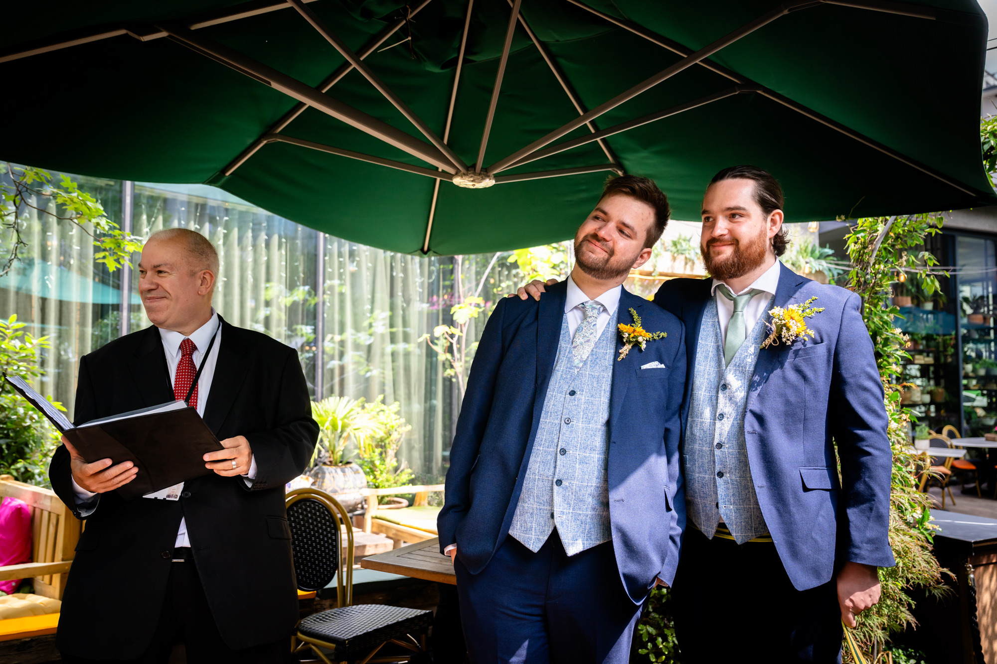 Celebrant standing with the groom and his best man, waiting at the top of the aisle
