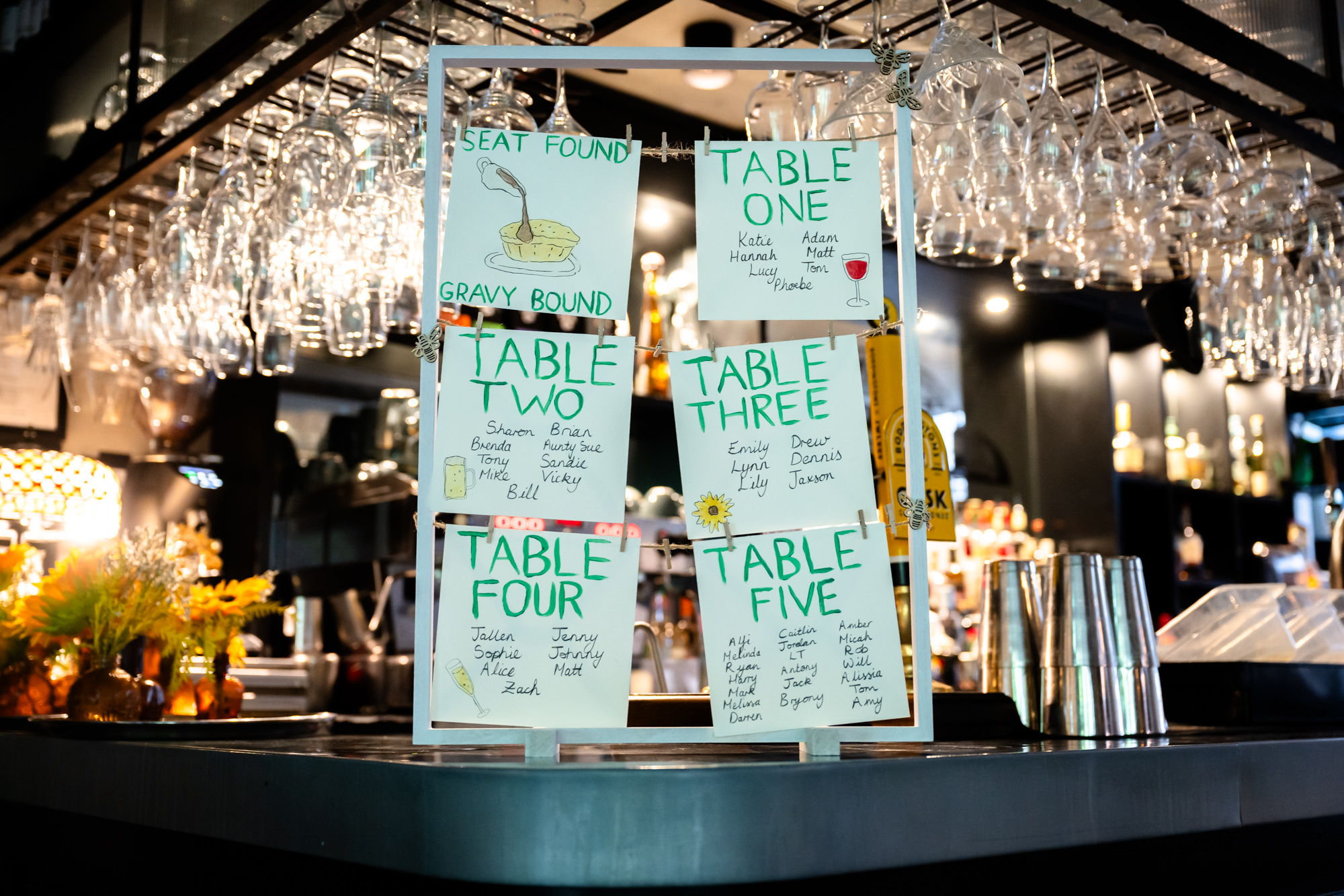 Hand-drawn wedding table plan sitting on the bar at the Black Friar Salford